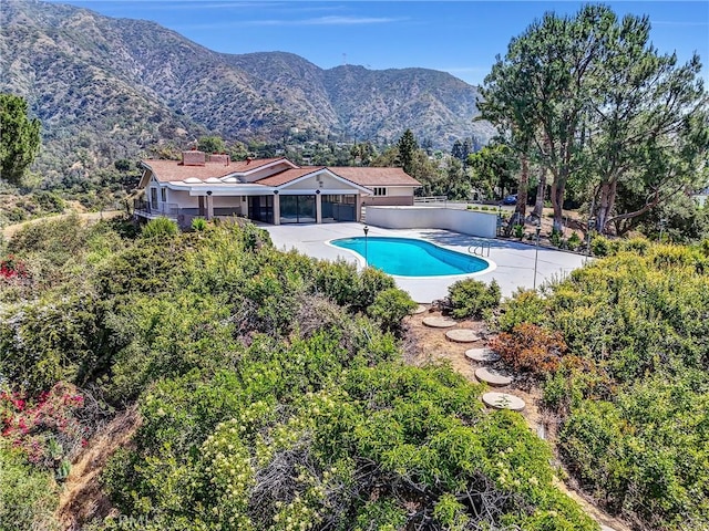 247 El Cielo Ln, Bradbury, CA 91008 - swimming pool featuring a patio area and a mountain view