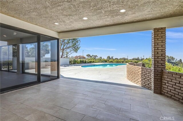 247 El Cielo Ln, Bradbury, CA 91008 - view of patio / terrace with an outdoor pool