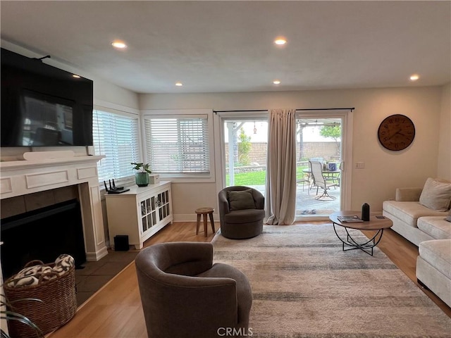 11171 Baylor St, Rancho Cucamonga, CA 91701 - living room featuring wood finished floors, recessed lighting, and a fireplace with flush hearth
