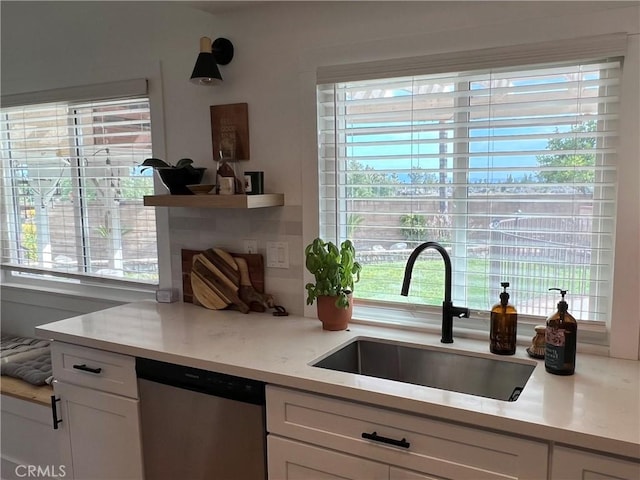 11171 Baylor St, Rancho Cucamonga, CA 91701 - kitchen with dishwasher, white cabinetry, and healthy amount of natural light