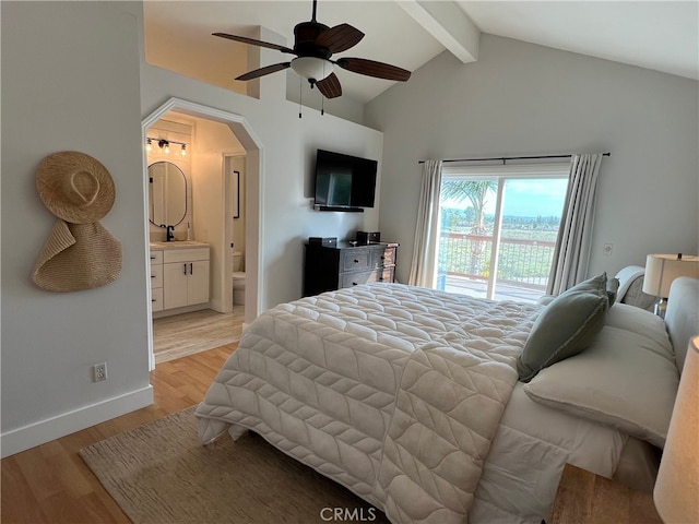 11171 Baylor St, Rancho Cucamonga, CA 91701 - bedroom featuring access to exterior, arched walkways, beam ceiling, light wood-type flooring, and ensuite bath