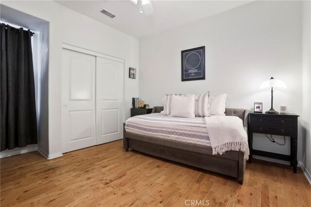 8338 Edgewood St, Chino, CA 91708 - bedroom with light wood finished floors, a closet, and ceiling fan