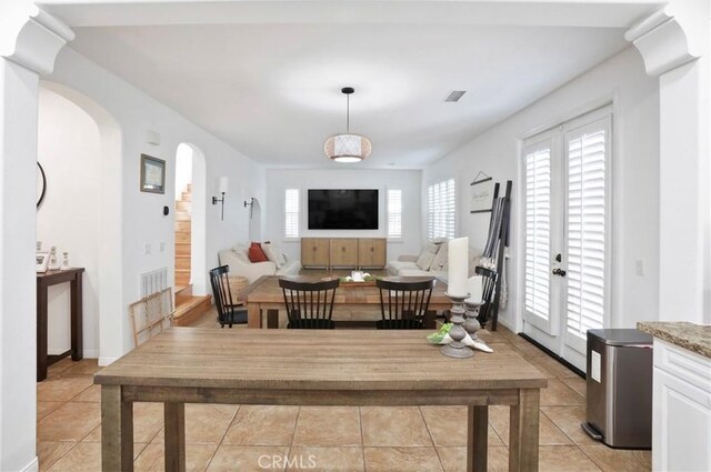 8338 Edgewood St, Chino, CA 91708 - dining space featuring light tile patterned flooring and arched walkways