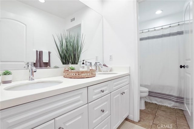 8338 Edgewood St, Chino, CA 91708 - bathroom featuring double vanity, a shower with curtain, tile patterned floors, and recessed lighting