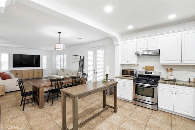 8338 Edgewood St, Chino, CA 91708 - kitchen featuring stainless steel appliances, under cabinet range hood, healthy amount of natural light, decorative backsplash, and recessed lighting
