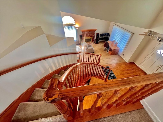 18725 Dallas Ave, Riverside, CA 92508 - staircase with a glass covered fireplace, high vaulted ceiling, and a ceiling fan
