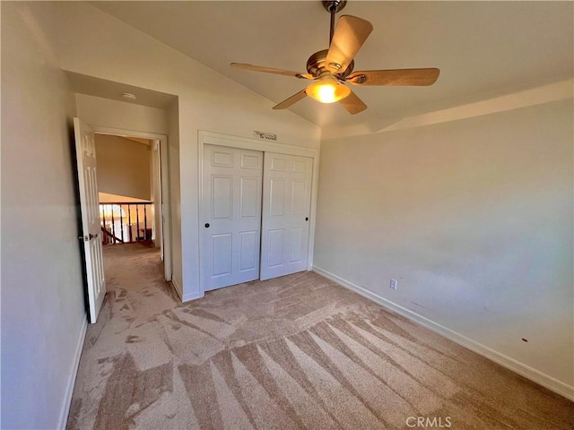 18725 Dallas Ave, Riverside, CA 92508 - unfurnished bedroom featuring light carpet, lofted ceiling, a closet, and a ceiling fan