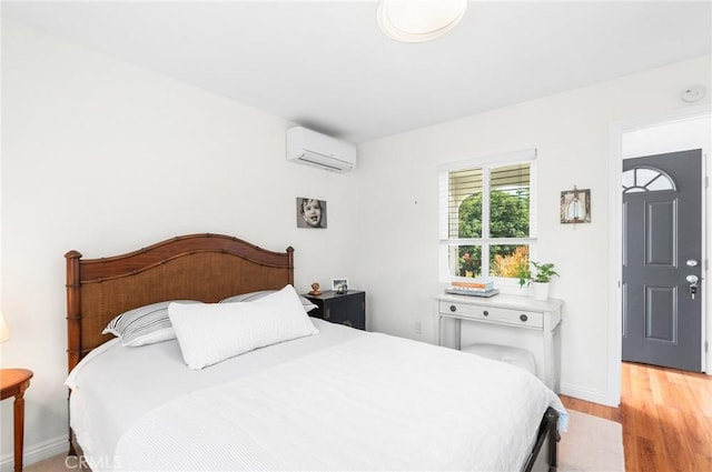 2109 Cathryn Dr, Rosemead, CA 91770 - bedroom featuring an AC wall unit and light wood-type flooring