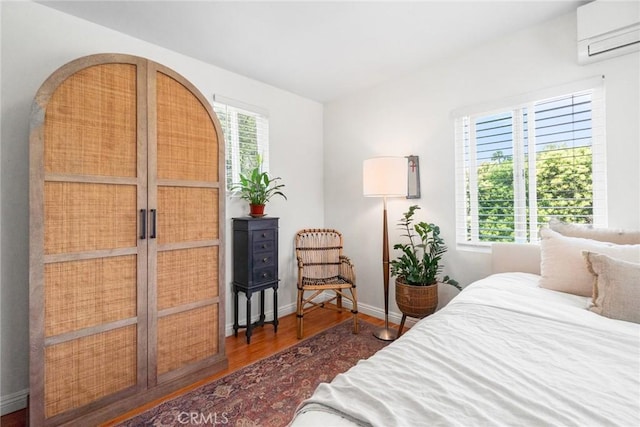 2109 Cathryn Dr, Rosemead, CA 91770 - bedroom featuring a wall mounted AC and wood finished floors