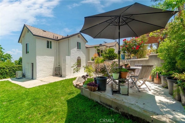 2109 Cathryn Dr, Rosemead, CA 91770 - rear view of property featuring stucco siding, a patio area, and a yard
