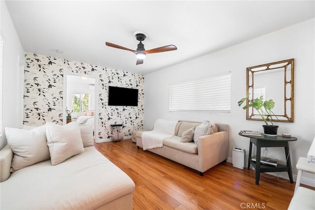 2109 Cathryn Dr, Rosemead, CA 91770 - living area with an accent wall, ceiling fan, and light wood-style flooring