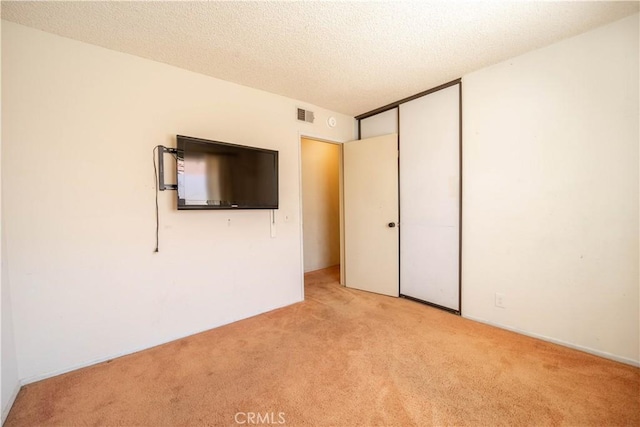3 Bonanza Ct, Pomona, CA 91766 - unfurnished bedroom featuring carpet flooring, a closet, and a textured ceiling