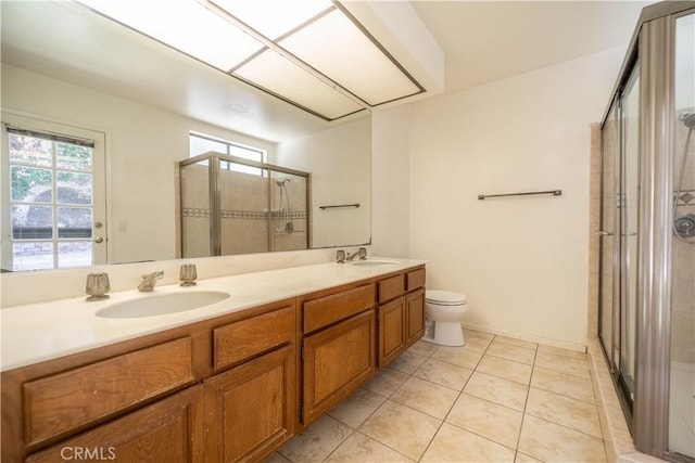 3 Bonanza Ct, Pomona, CA 91766 - full bathroom featuring a stall shower, double vanity, plenty of natural light, and tile patterned flooring