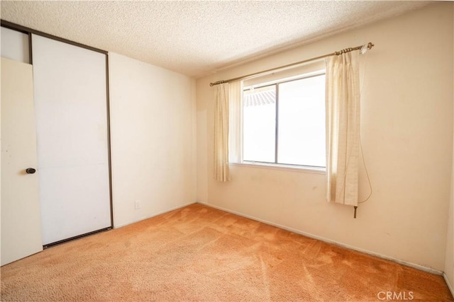 3 Bonanza Ct, Pomona, CA 91766 - empty room featuring carpet and a textured ceiling