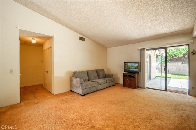 3 Bonanza Ct, Pomona, CA 91766 - living area featuring a textured ceiling, light carpet, and vaulted ceiling