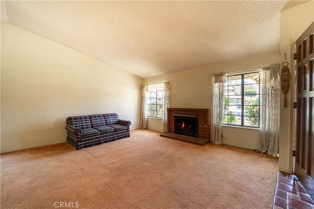 3 Bonanza Ct, Pomona, CA 91766 - living room with a textured ceiling, a fireplace, and carpet flooring