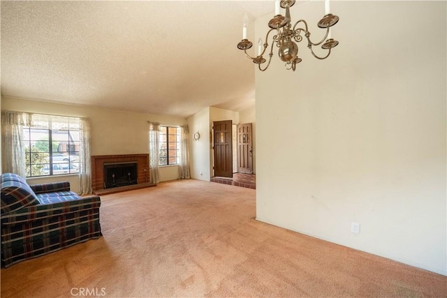 3 Bonanza Ct, Pomona, CA 91766 - carpeted living room with a chandelier, a textured ceiling, a fireplace, and lofted ceiling