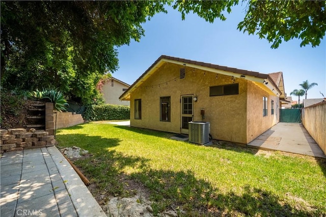 3 Bonanza Ct, Pomona, CA 91766 - rear view of house featuring stucco siding, a fenced backyard, and a patio area