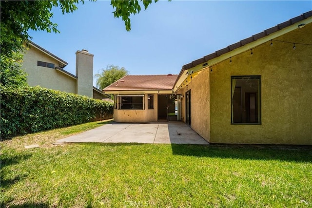 3 Bonanza Ct, Pomona, CA 91766 - rear view of property with a patio area, stucco siding, a yard, and a tiled roof