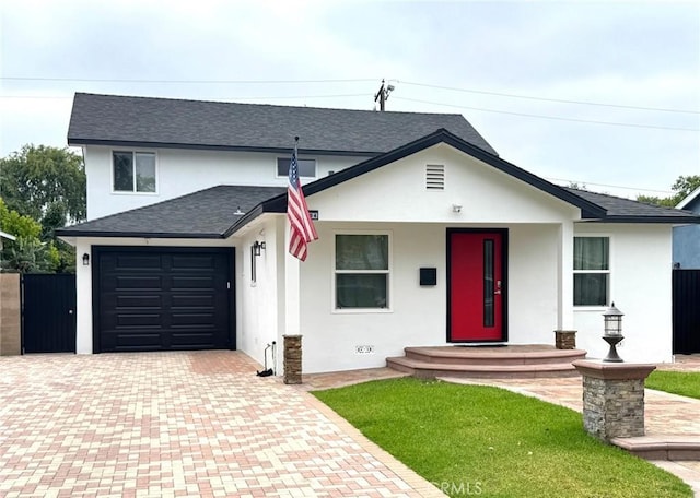 2404 W Oak Ave, Fullerton, CA 92833 - view of front of home with decorative driveway, stucco siding, an attached garage, and a shingled roof