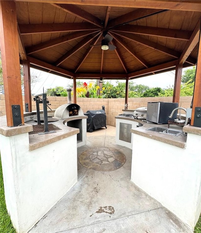 2404 W Oak Ave, Fullerton, CA 92833 - fenced backyard featuring a gazebo, exterior kitchen, and a patio area