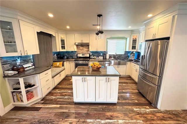 2404 W Oak Ave, Fullerton, CA 92833 - kitchen featuring appliances with stainless steel finishes, under cabinet range hood, dark countertops, backsplash, and recessed lighting