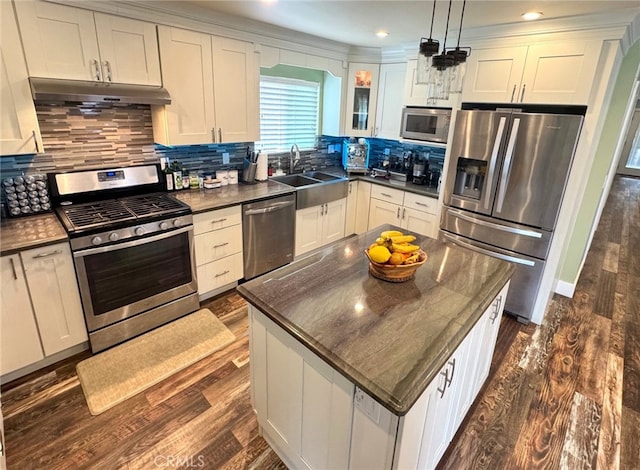 2404 W Oak Ave, Fullerton, CA 92833 - kitchen featuring stainless steel appliances, under cabinet range hood, dark wood finished floors, decorative backsplash, and recessed lighting