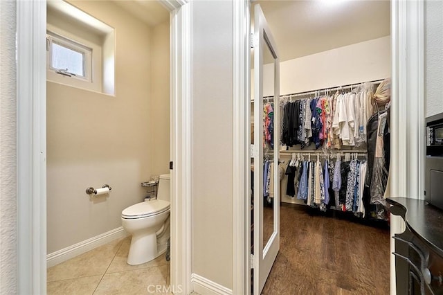 524 S Petunia St, La Habra, CA 90631 - bathroom featuring a walk in closet and tile patterned flooring