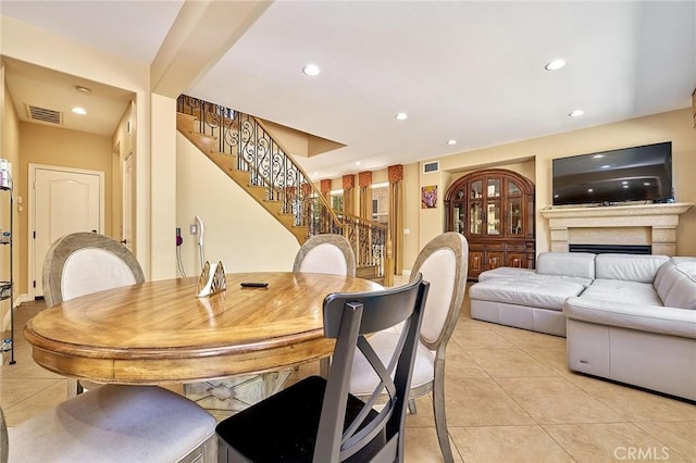524 S Petunia St, La Habra, CA 90631 - dining space with light tile patterned floors, stairs, recessed lighting, and a fireplace