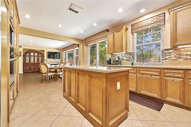 524 S Petunia St, La Habra, CA 90631 - kitchen with a center island, light tile patterned floors, backsplash, and recessed lighting