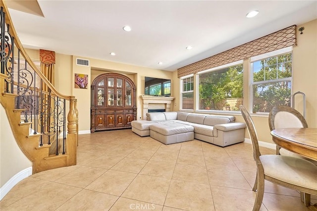 524 S Petunia St, La Habra, CA 90631 - living area with recessed lighting, a fireplace, light tile patterned floors, and stairs