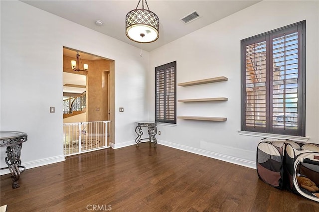 524 S Petunia St, La Habra, CA 90631 - unfurnished room featuring wood finished floors and a chandelier