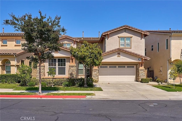 524 S Petunia St, La Habra, CA 90631 - view of front of house with an attached garage, concrete driveway, stone siding, and stucco siding
