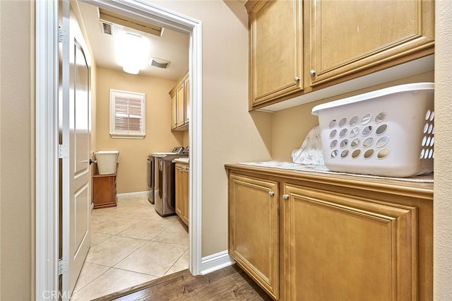 524 S Petunia St, La Habra, CA 90631 - laundry room featuring washer and dryer, light tile patterned floors, and cabinet space