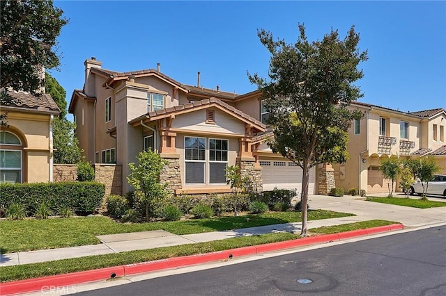 524 S Petunia St, La Habra, CA 90631 - view of front of property with concrete driveway, stone siding, a chimney, a garage, and stucco siding