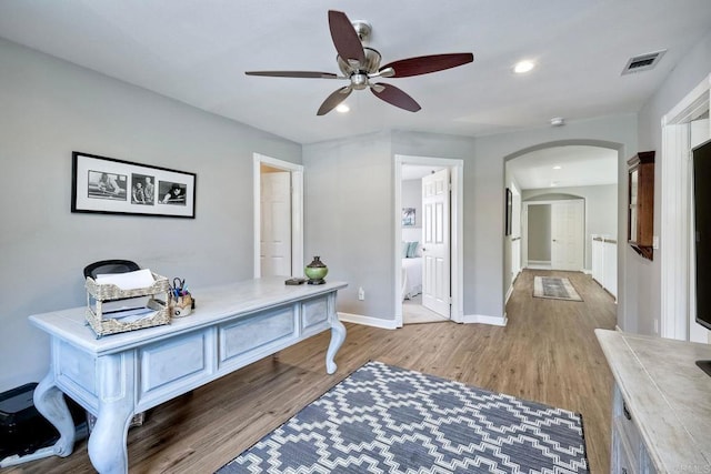 1709 Blackbird Cir, Carlsbad, CA 92011 - office featuring arched walkways, ceiling fan, wood finished floors, and recessed lighting
