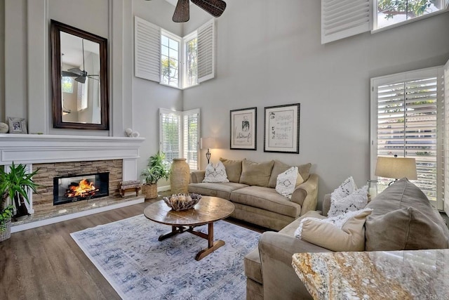 1709 Blackbird Cir, Carlsbad, CA 92011 - living area featuring a ceiling fan, wood finished floors, healthy amount of natural light, a towering ceiling, and a fireplace