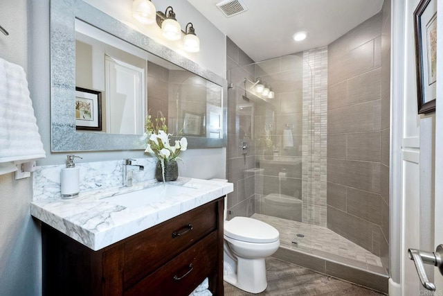 1709 Blackbird Cir, Carlsbad, CA 92011 - bathroom featuring vanity, tiled shower, and wood finished floors