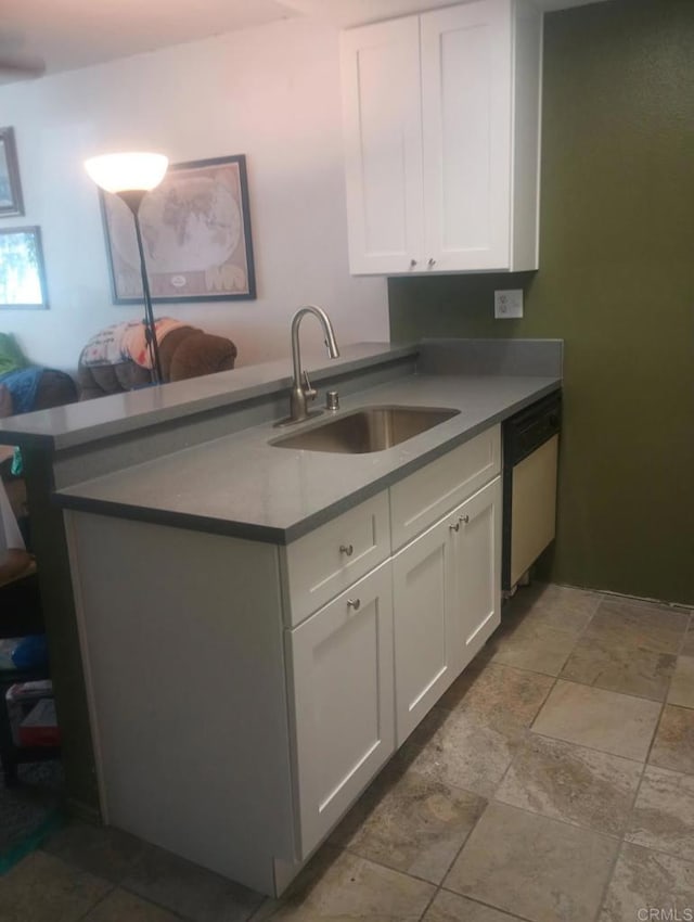 10737 San Diego Mission Rd Unit 111, San Diego, CA 92108 - kitchen featuring dishwasher, stone tile floors, and white cabinets