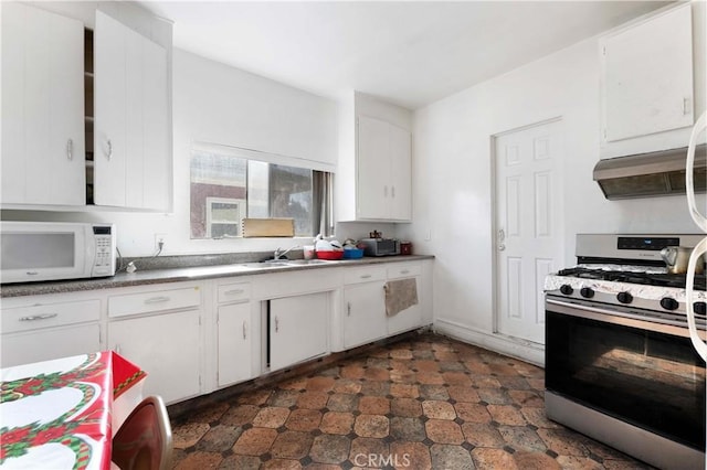 2005 Magnolia Ave, Los Angeles, CA 90007 - kitchen with stainless steel gas range, white microwave, and white cabinets