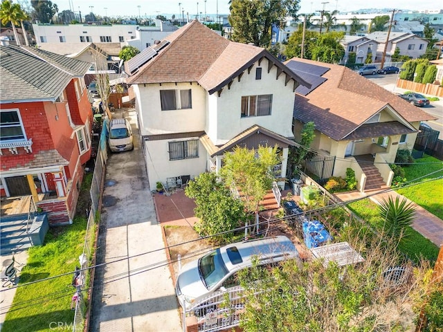 2005 Magnolia Ave, Los Angeles, CA 90007 - view of front facade with a shingled roof, stucco siding, driveway, and a residential view