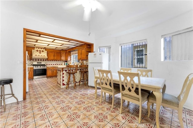 2005 Magnolia Ave, Los Angeles, CA 90007 - dining space with healthy amount of natural light, ceiling fan, and light tile patterned flooring