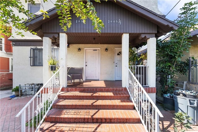 2005 Magnolia Ave, Los Angeles, CA 90007 - property entrance with covered porch and stucco siding