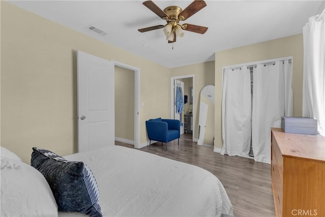 74417 Maricopa Dr Unit 29, Palms, CA 92277 - bedroom with wood finished floors and a ceiling fan