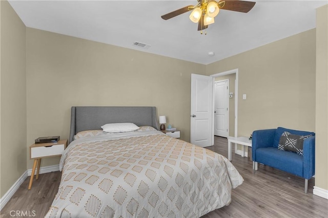 74417 Maricopa Dr Unit 29, Palms, CA 92277 - bedroom with wood finished floors and a ceiling fan