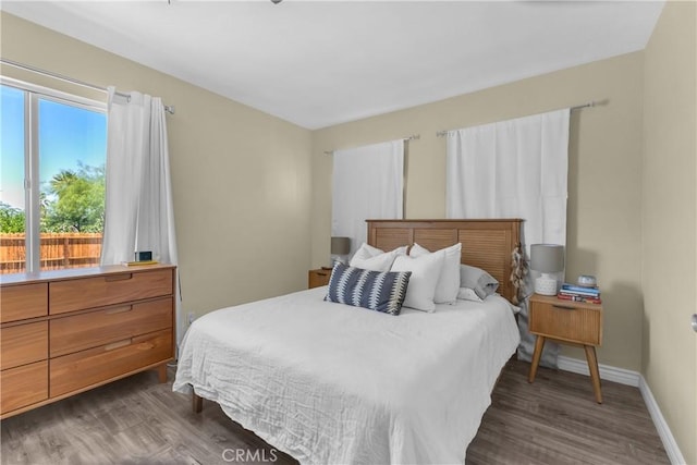 74417 Maricopa Dr Unit 29, Palms, CA 92277 - bedroom featuring dark wood-type flooring and baseboards