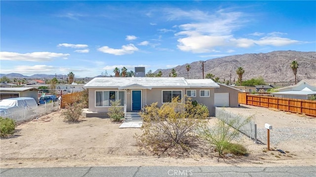 74417 Maricopa Dr Unit 29, Palms, CA 92277 - ranch-style home featuring a mountain view, stucco siding, and a garage