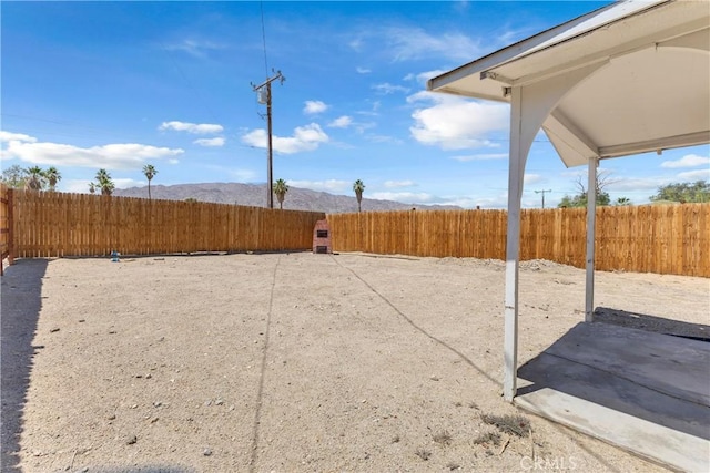 74417 Maricopa Dr Unit 29, Palms, CA 92277 - fenced backyard featuring a mountain view and a patio