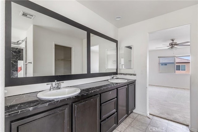 3720 Mount Whitney Ave, Rosamond, CA 93560 - full bathroom with double vanity and a ceiling fan