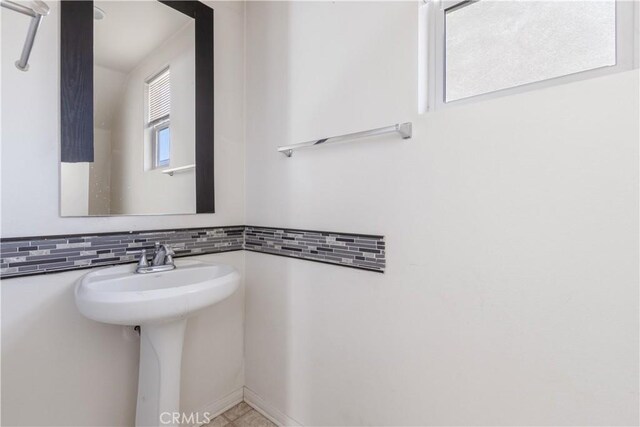 3720 Mount Whitney Ave, Rosamond, CA 93560 - bathroom with a sink and tasteful backsplash